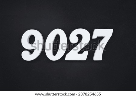 Black for the background. The number 9027 is made of white painted wood.