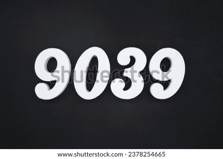 Black for the background. The number 9039 is made of white painted wood.