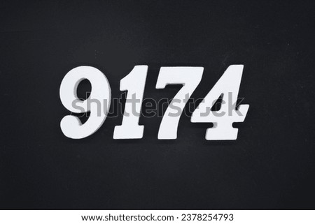 Black for the background. The number 9174 is made of white painted wood.