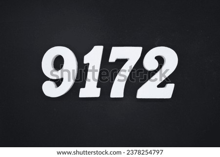 Black for the background. The number 9172 is made of white painted wood.