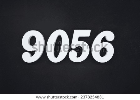 Black for the background. The number 9056 is made of white painted wood.