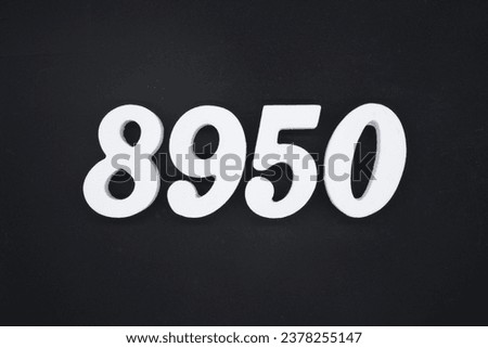Black for the background. The number 8950 is made of white painted wood.