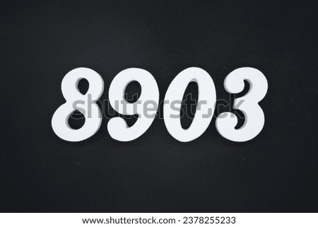 Black for the background. The number 8903 is made of white painted wood.
