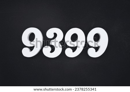 Black for the background. The number 9399 is made of white painted wood.