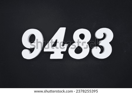 Black for the background. The number 9483 is made of white painted wood.