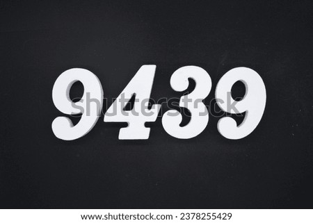 Black for the background. The number 9439 is made of white painted wood.