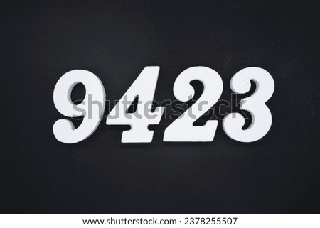 Black for the background. The number 9423 is made of white painted wood.