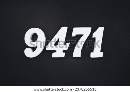 Black for the background. The number 9471 is made of white painted wood.