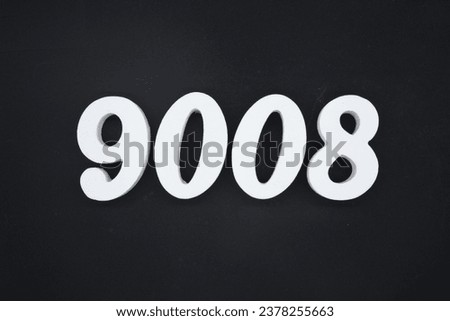 Black for the background. The number 9008 is made of white painted wood.