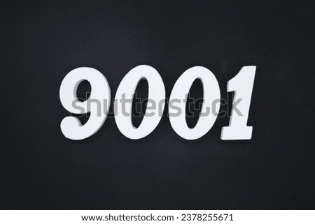 Black for the background. The number 9001 is made of white painted wood.