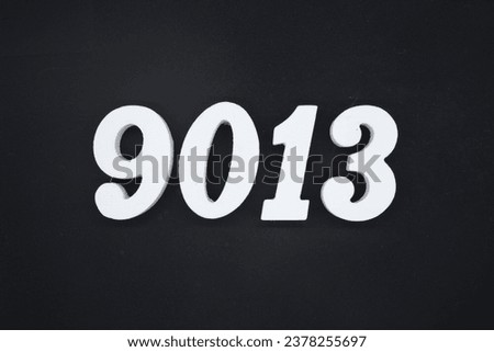 Black for the background. The number 9013 is made of white painted wood.