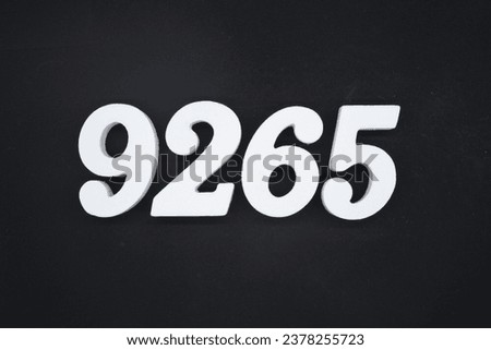 Black for the background. The number 9265 is made of white painted wood.