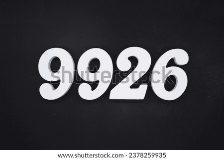 Black for the background. The number 9926 is made of white painted wood.
