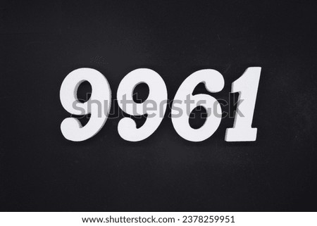 Black for the background. The number 9961 is made of white painted wood.