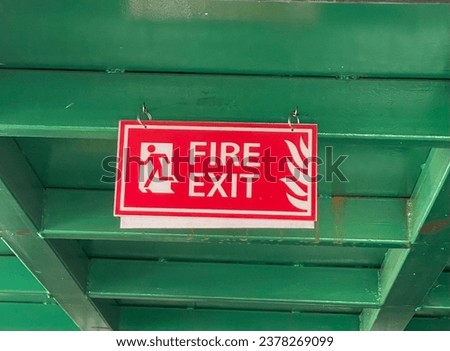 Fire exit warning sign . Fire exit direction sign board