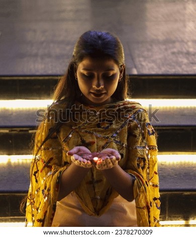 Indian girl holding diya in hand for diwali indian festival