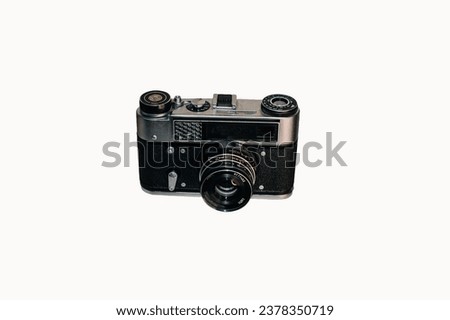 Old film camera with a small lens.