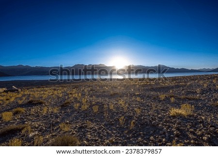 Sunrise and blue sky in background at Pangong Tso (High grassland lake), or Pangong Lake, an endorheic lake in the Himalayas, Leh, Ladakh, Jammu and Kashmir, India.
