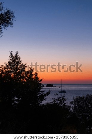 Beautiful light as the sun sets at a beach at Latsi in Paphos district, Cyprus Royalty-Free Stock Photo #2378386055