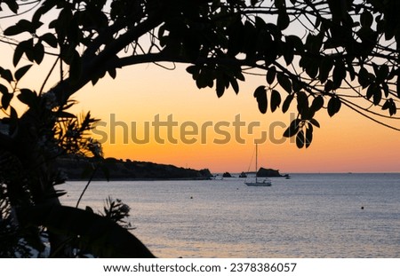 Beautiful light as the sun sets at a beach at Latsi in Paphos district, Cyprus Royalty-Free Stock Photo #2378386057