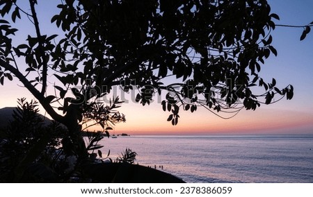 Beautiful light as the sun sets at a beach at Latsi in Paphos district, Cyprus Royalty-Free Stock Photo #2378386059