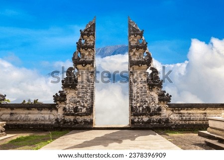 Ancient gate at Pura Penataran Agung Lempuyang temple and volcano Agung on Bali, Indonesia in a sunny day Royalty-Free Stock Photo #2378396909