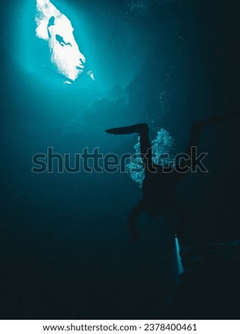 A diver hovers below the sunlight cavern entrance at Buford Sink, Chassahowitzka Wildlife Management Area, Florida, Florida