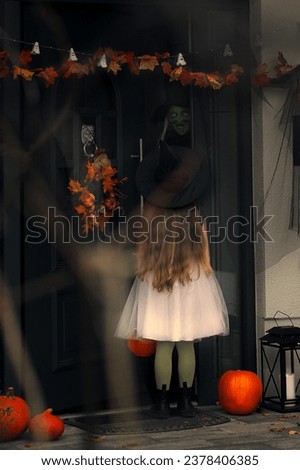 a girl in a fluffy skirt near the witch's house Royalty-Free Stock Photo #2378406385