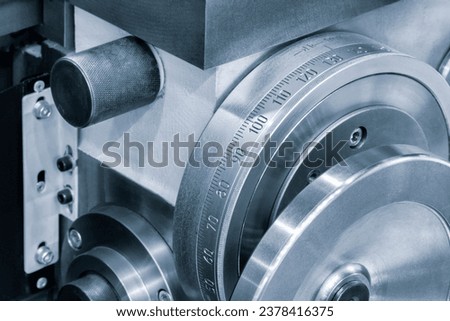 Lathe control knobs close up blue tone. Metal machine tools industry. The metalworking process by turning machine. industry metal processing concept background Royalty-Free Stock Photo #2378416375