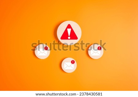 Cybersecurity awareness, An exclamation mark in triangle caution warning sign and e-mail alert notification error on wooden labels. Internet network security, Email malware virus delete computer data.