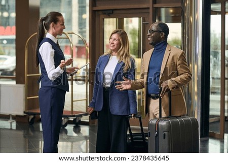 Manager of the hotel meeting the guests Royalty-Free Stock Photo #2378435645