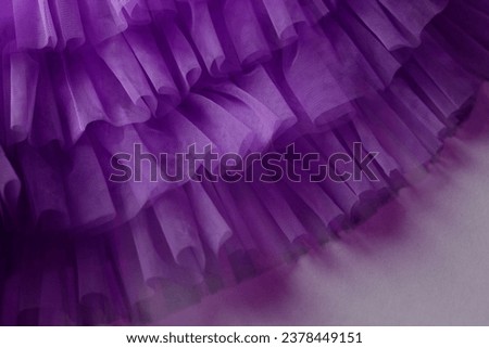 Dark purple chiffon texture tissue: violet mesh fabric tulle with folds, lilac dress lace textile. Lavender folded skirt cloth, aesthetic very peri background Royalty-Free Stock Photo #2378449151