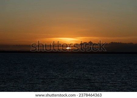 Sun setting at the ocean in Salvador, Bahia.