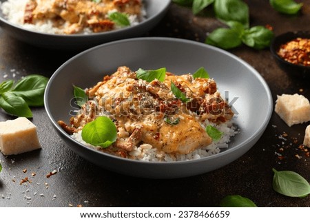Marry Me Chicken. Creamy Garlic Sun Dried Tomato Chicken with rice. Healthy food Royalty-Free Stock Photo #2378466659