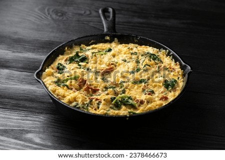 Creamy spaghetti squash pasta with parmesan cheese and sun dried tomato sauce in iron cast pan Royalty-Free Stock Photo #2378466673