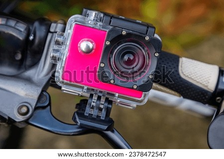 Action camera in a protective box for shooting dynamic videos.