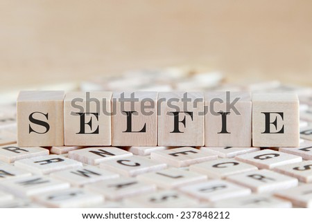 selfie word background on wood blocks