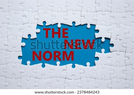 The new norm symbol. Concept words The new norm on white puzzle. Beautiful blue background. Business and The new norm concept. Copy space. Royalty-Free Stock Photo #2378484243