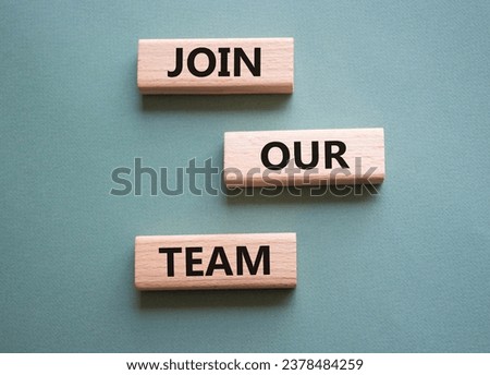 Join our team symbol. Wooden blocks with words Join our team. Beautiful grey green background. Business and Join our team concept. Copy space.