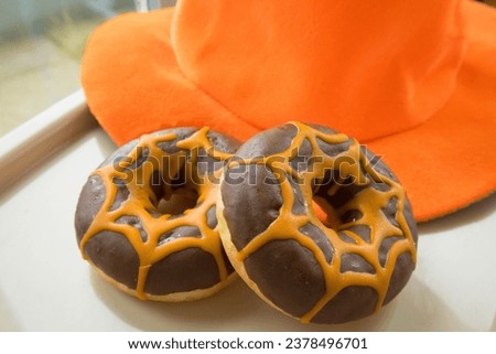 Two tasty haloween chocolate donuts