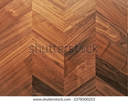Dark walnut chevron (fishbone) surface. Natural interior design for tables, backdrops, floors and parquet Royalty-Free Stock Photo #2378500253