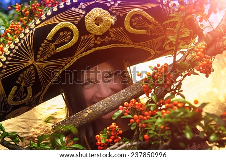 girl with sombrero smiling