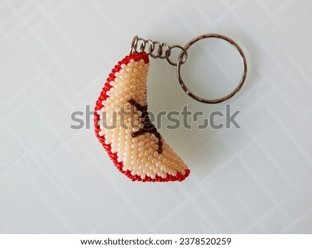 Colorful key chain on a white. Bright key chain on a white