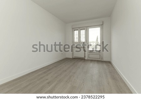 Empty room of a detached house with wooden floors, plaster moldings on the ceiling,