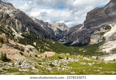 Valley Val Travenanzes and path way rock face in Tofane gruppe, Alps Dolomites mountains, Fanes national park, Italy Royalty-Free Stock Photo #2378535071