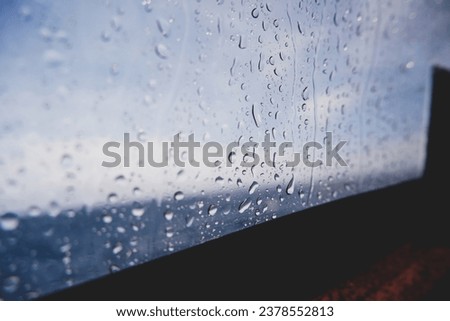 Rainy day, Rain falling on the speedboat window, rainy weather, rain on the sea, rainy background stock photo