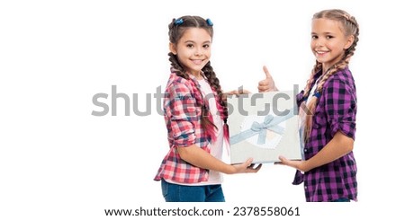 children girls with boxes. happy birthday. birthday gift box. children girls sharing gift. gift to friend. gift box from shopping. Girls carefully handling the box. copy space