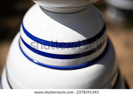 View of stacked blue and white enamel bowls