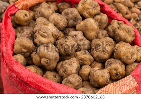Photography of a group of potatoes in a traditional fair in Peru. Food concept.