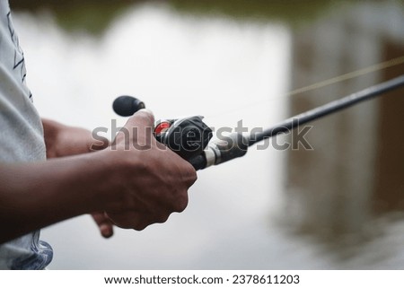 This professionally captured stock photo showcases a top-of-the-line baitcasting reel, designed for serious anglers who demand precision and performance. The high-resolution image highlights the sleek